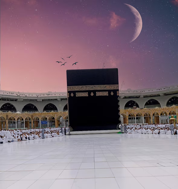 The Kaaba at Masjid al-Haram beneath a moonlit sky